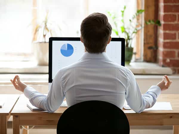 Man meditating over Distribution ERP Software